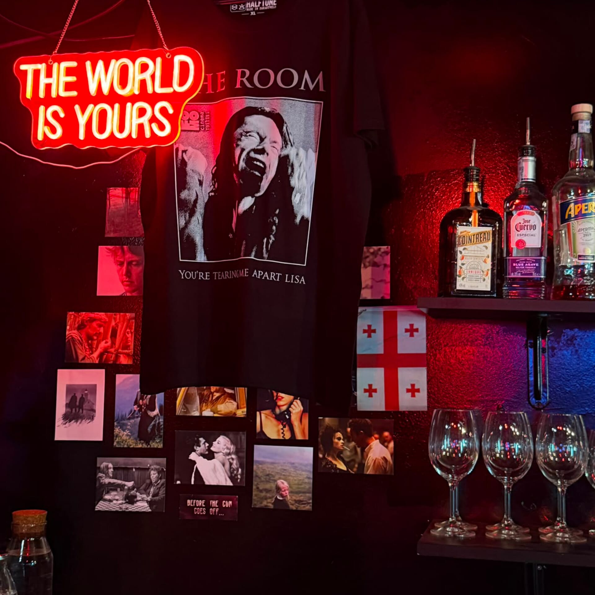 FOMO merch hanging above the bar beside a wall of film stills